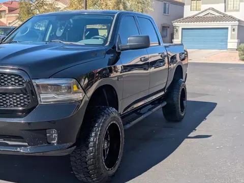 The same black Ram 1500 washed, with clear headlights